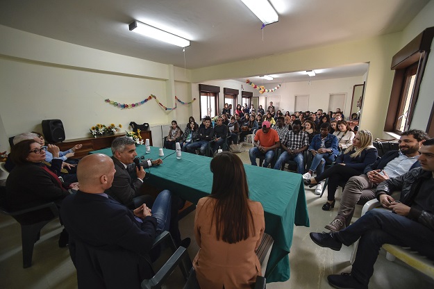 Stefano Calibre mayor of Sant' Alessio in Aspromonte, a small village of 330 inhabitants in Calabria, southern Italy, speaks during a meeting between students in architecture at the University of Reggio Calabria and migrants, as part of a project of redevelopment of houses and public spaces, on April 6, 2017. PHOTO: AFP