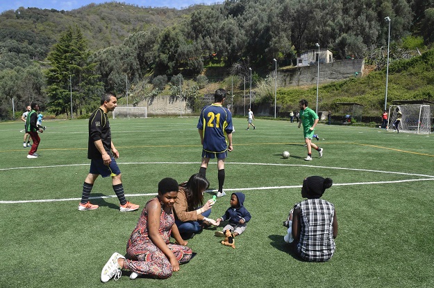 Mohammed (left) a migrant from Gambia plays football against a local team in Sant 'Alessio in Aspromonte, a small village of 330 inhabitants in Calabria, southern Italy, April 6, 2017. PHOTO: AFP