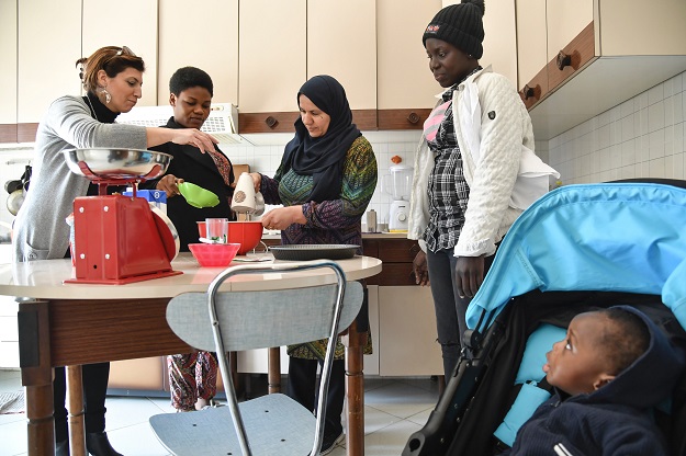 Migrant women (2nd from left) Eunice from Nigeria, Najiba from Iraq and Hawa from Gambia, attend a cooking class at Sant 'Alessio in Aspromonte, a small village of 330 inhabitants in Calabria, in the south of the Italy, April 6, 2017. PHOTO: AFP