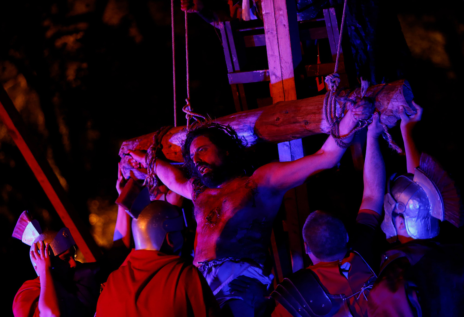 An actor portrays the crucified Jesus Christ during the interactive street-theatre Passion play 
