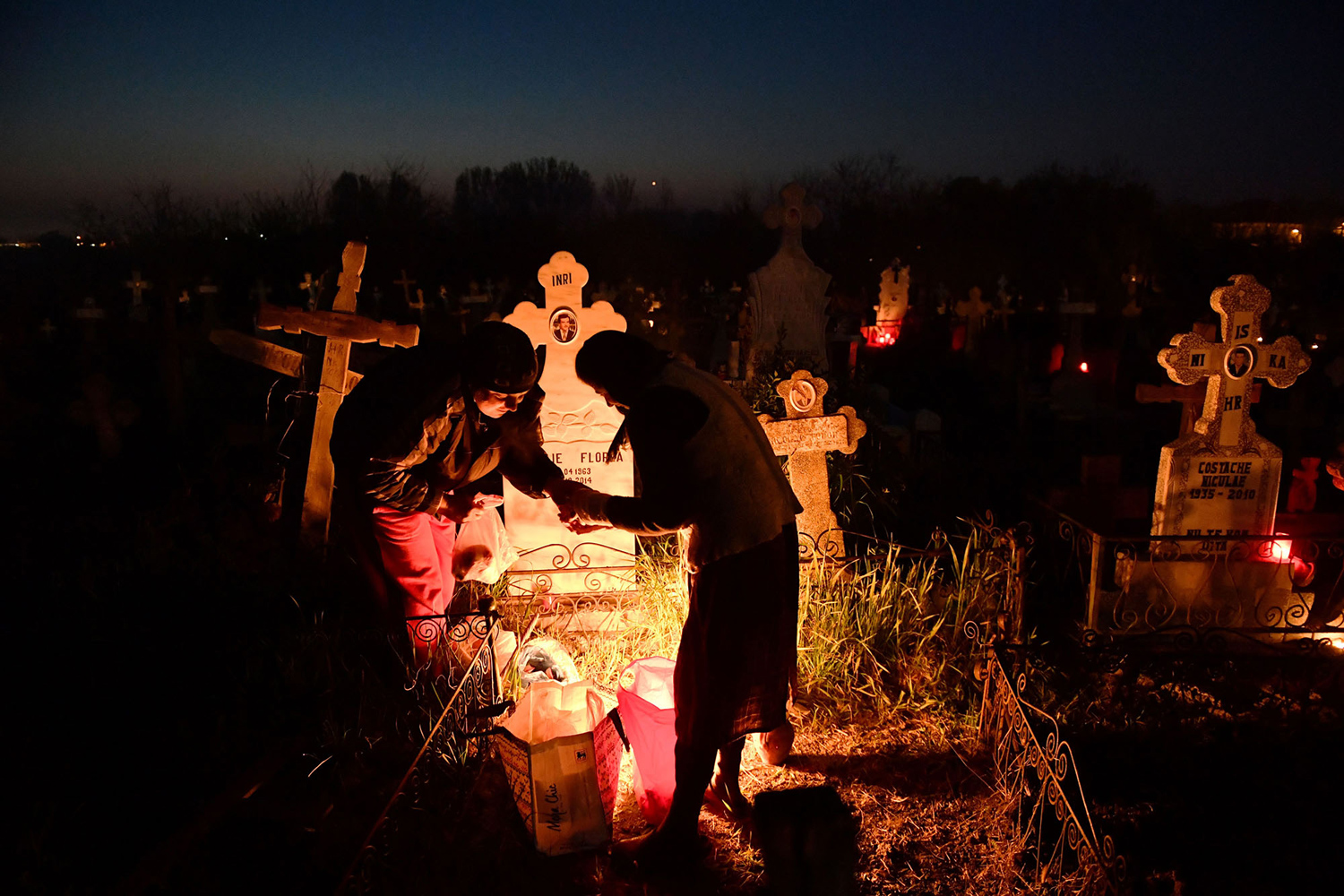 Villagers from Copaciu light fires at the village cemetery, three days before the celebration of Orthodox Easter. According to popular belief, fires lit on Thursday help the souls of the dead to return to visit their homes and relatives. PHOTO: AFP 