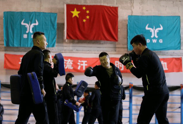 Trainees from Dewei Security attend boxing training at a training camp, on the outskirts of Beijing, China March 2, 2017. PHOTO: REUTERS