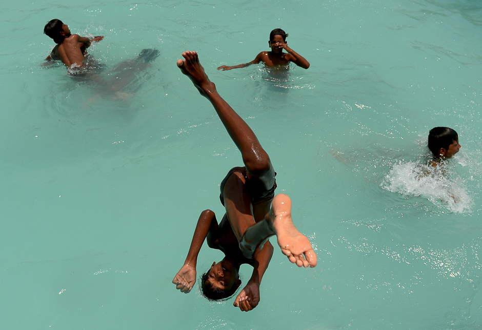 An Indian youth dives into a swimming pool in Chennai. PHOTO: AFP