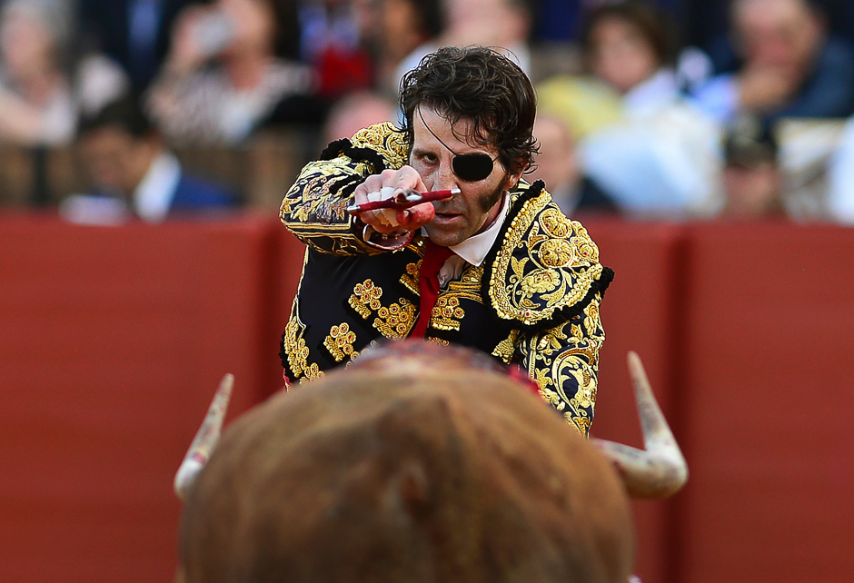Spanish matador Juan Jose Padilla prepares to kill the bull with the sword during a bullfight at the Maestranza bullring, in Sevilla. PHOTO: AFP