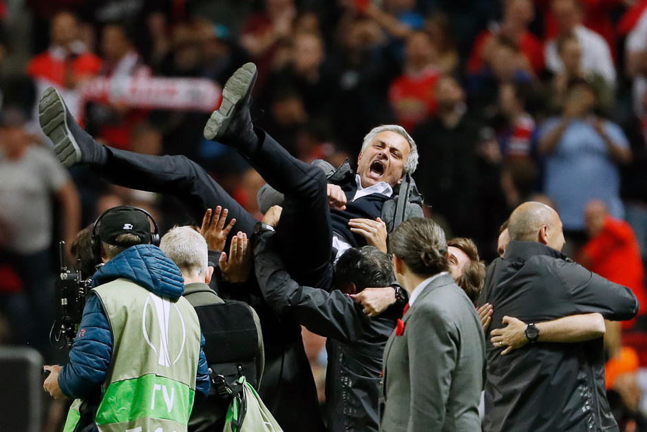 Manchester United's Portuguese manager Jose Mourinho is thrown in the air by his staff after the UEFA Europa League final football match Ajax Amsterdam v Manchester United at the Friends Arena in Solna outside Stockholm. PHOTO: AFP