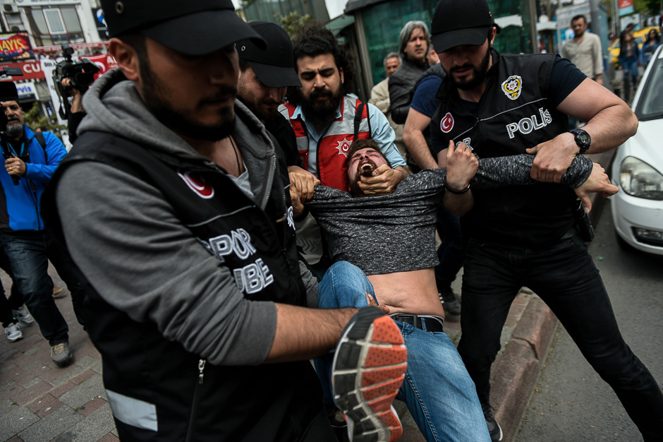Kish riot police arrest a protester attempting to defy a ban and march on Taksim Square to celebrate May Day in Istanbul. PHOTO: AFP
