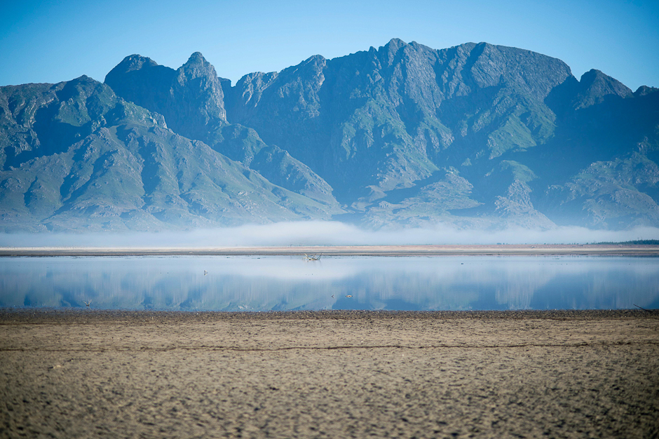 Bare sand and a narrow body of water facing the sky at Theewaterskloof Dam, which has less than 20% of it's water capacity, near Villiersdorp, about 108Km from Cape Town. PHOTO: AFP