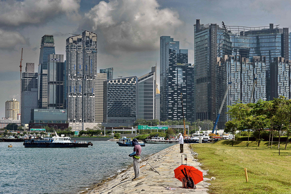 A man fishes in the bay in Singapore. PHOTO: AFP