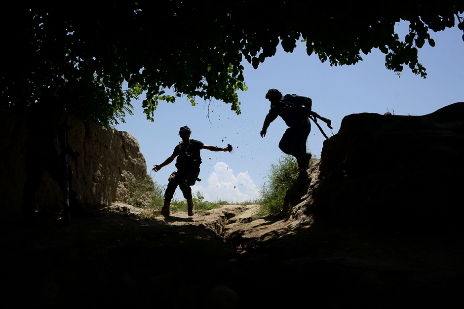 Afghan security force personnel patrol during an operation against Islamic State (IS) militants in the Chaparhar district of Nangarhar province. PHOTO: AFP