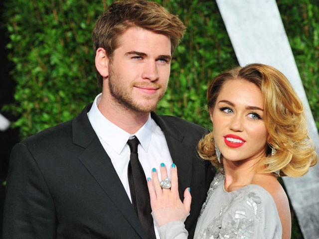 Earlier, Miley shared an image of herself wearing a T-shrit with Hemsworth written on the back. PHOTO: COSMOPOLITAN
