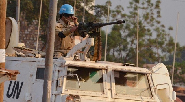 A Moroccan peacekeeper from a United Nations Mission in a Central African Republic (MINUSCA) patrols in Bangui, forward a republic presidential elections PHOTO:AFP