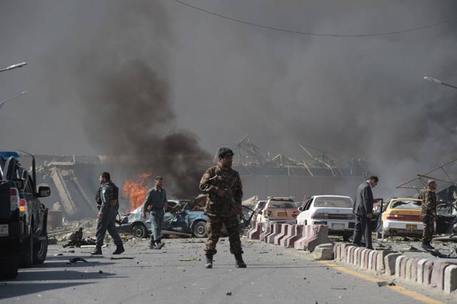 an afghan security force member stands at the site of a car bomb attack in kabul on may 31 2017 photo afp