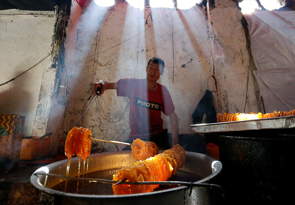 A man prepares special sweets at a small traditional factory on the first day of the holy month of Ramadan in Kabul, Afghanistan. PHOTO: REUTERS