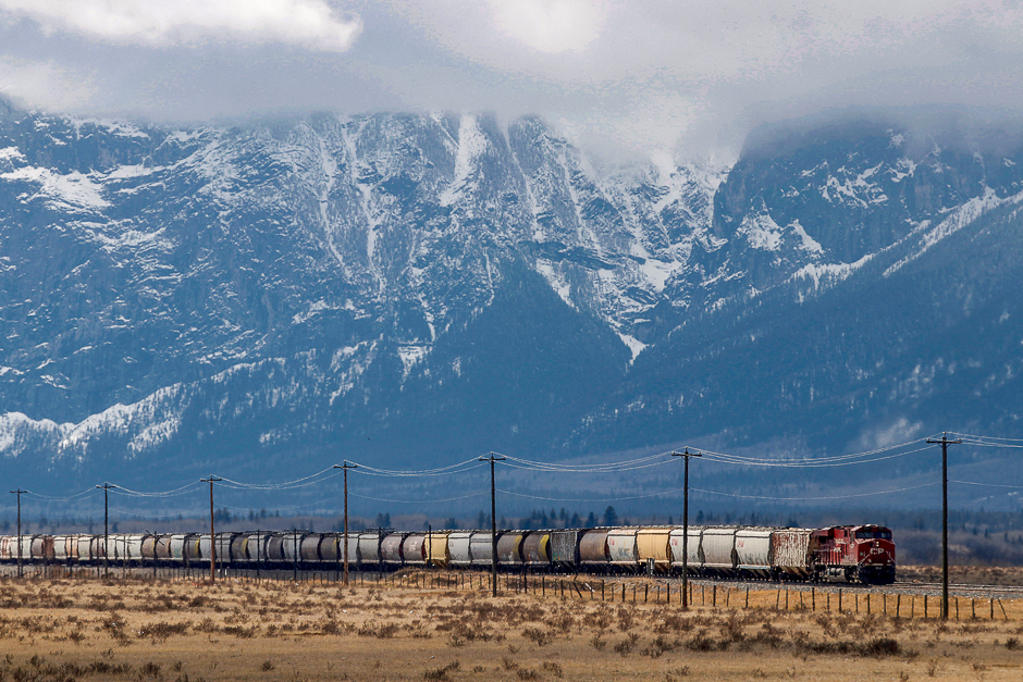 A CP Rail train rolls across the prairies into the rocky mountains of near Canmore. PHOTO: REUTERS