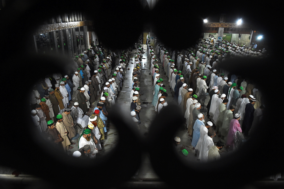 Pakistani muslims perform Taraweeh prayers on the start of the holy month of Ramadan at a mosque in Lahore. PHOTO: REUTERS