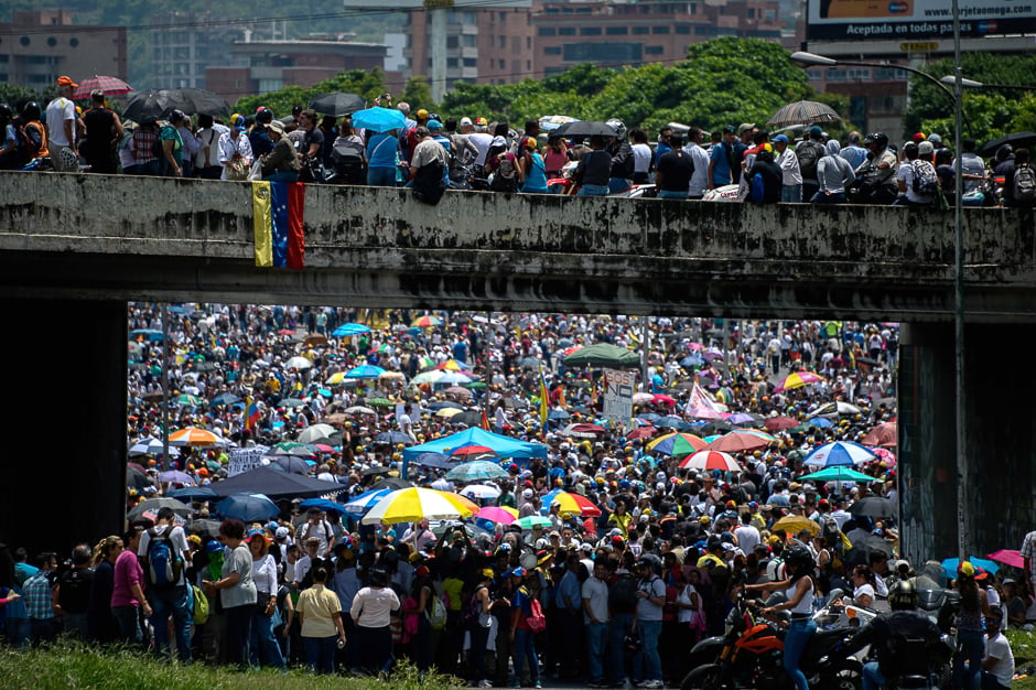 Venezuelan opposition activists carry out a protest against the government of President Nicolas Maduro, in Caracas. PHOTO: AFP