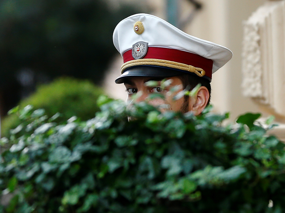 An Austrian police officer guards the entrance of a hotel before the arrival of OPEC Oil Ministers in Vienna, Austria. PHOTO: REUTERS