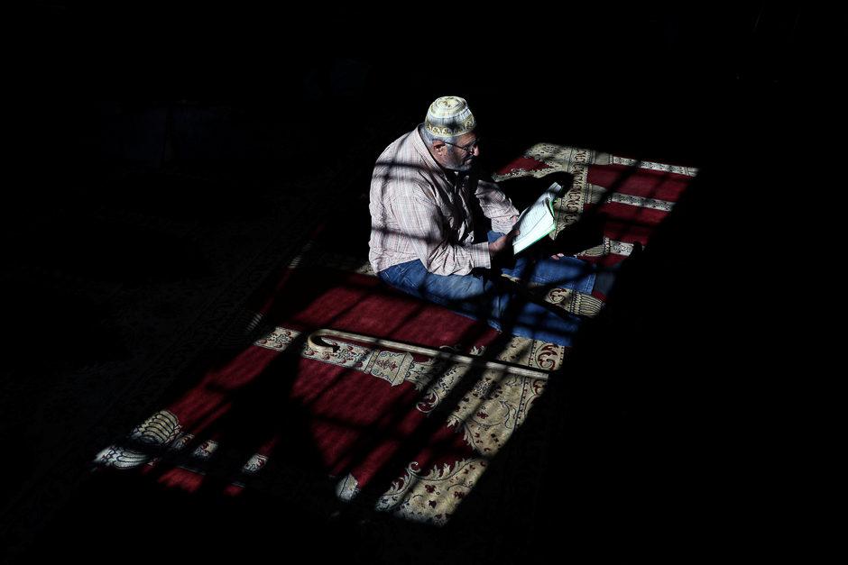 A Palestinian man reads the Quran in al-Aqsa Mosque, on the compound known to Muslims as al-Haram al-Sharif and to Jews as Temple Mount, in Jerusalem's Old City during the holy month of Ramadan. PHOTO: REUTERS