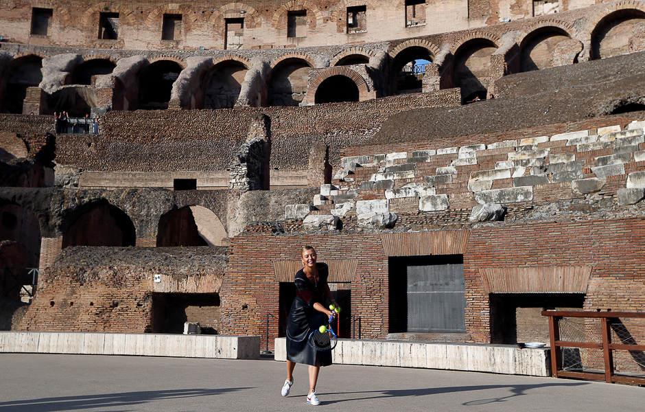Maria Sharapova of Russia hits a tennis ball during an exhibition match inside the ancient Colosseum in Rome, Italy. PHOTO: REUTERS