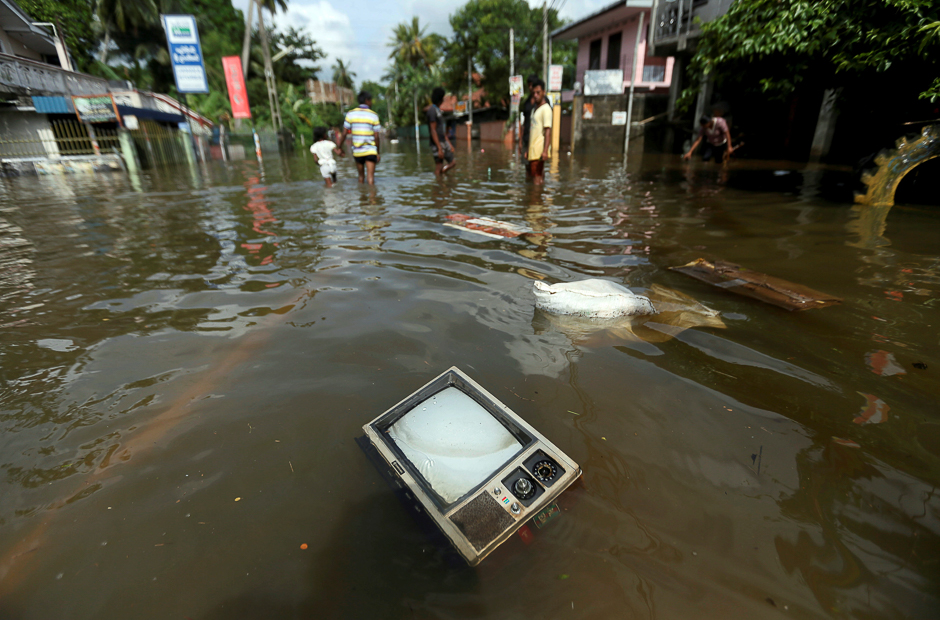 A TV set floats on a flooded road in Dodangoda village in Kalutara, Sri Lanka. PHOTO: REUTERS