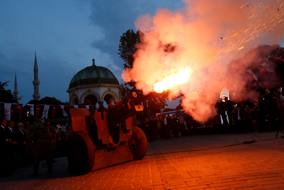 A cannon fires a ceremonial shot to start iftar, the evening meal for breaking fast, on the first day of the holy fasting month of Ramadan at Sultanahmet Square in Istanbul. PHOTO: REUTERS