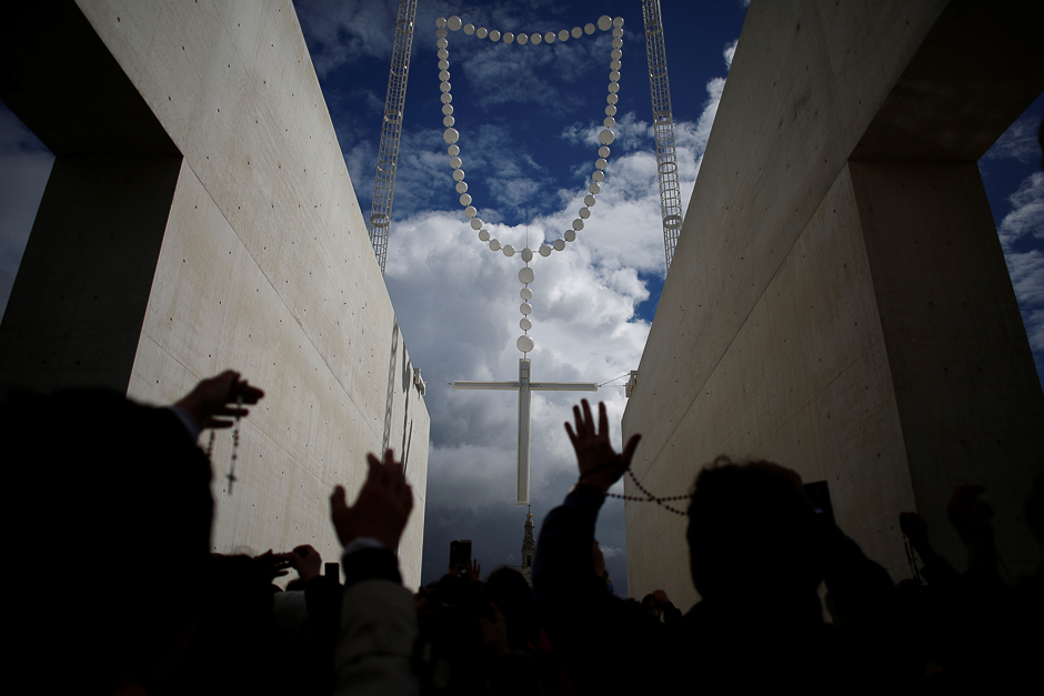 Pilgrims pray before Pope Francis's arrival at the Catholic shrine of Fatima, Portugal. PHOTO: REUTERS