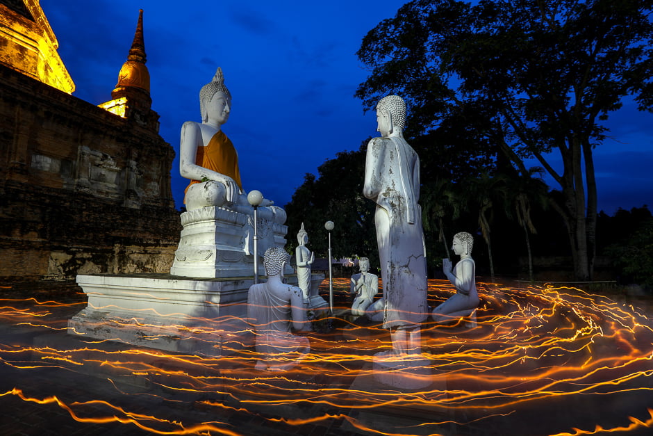 Buddhists carry candles as they pray during Vesak Day, an annual celebration of Buddha's birth, enlightenment and death, at Wat Yai Chai Mongkhon temple in Ayutthaya, Thailand. PHOTO: REUTERS