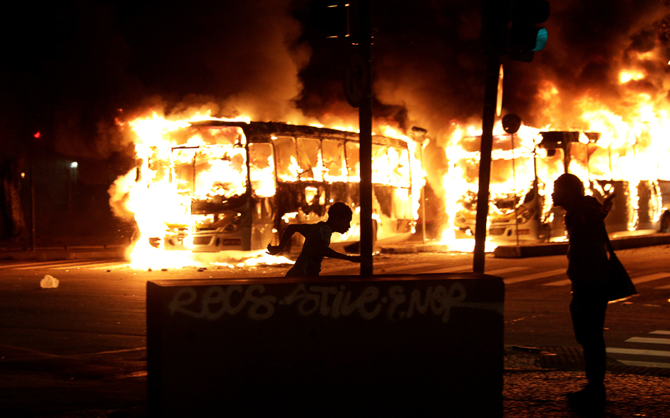 Buses burn during clashes between demonstrators and riot police in a protest against President Michel Temer's proposed reform of Brazil's social security system, in Rio de Janeiro, Brazil. PHOTO: REUTERS