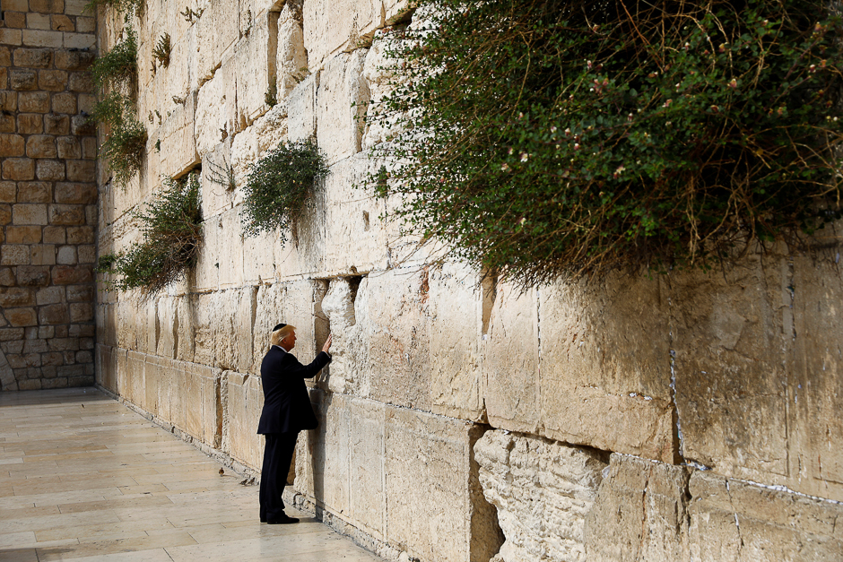 US President Donald Trump touches the Western Wall, Judaism's holiest prayer site, in Jerusalem's Old City. PHOTO: REUTERS