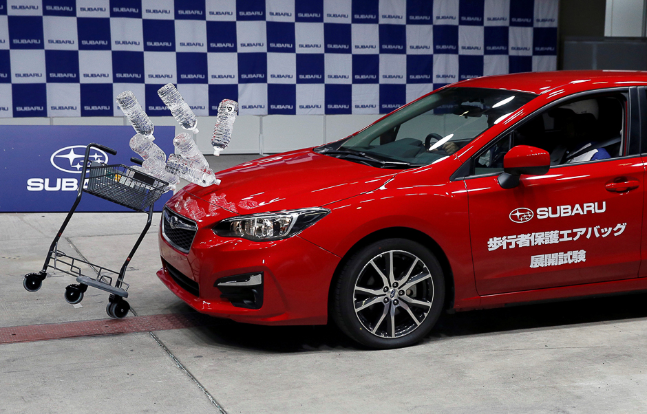 Subaru's new XV hits a shopping cart carrying water bottles during a collision test demonstration at its factory in Ota, north of Tokyo, Japan. PHOTO: REUTERS