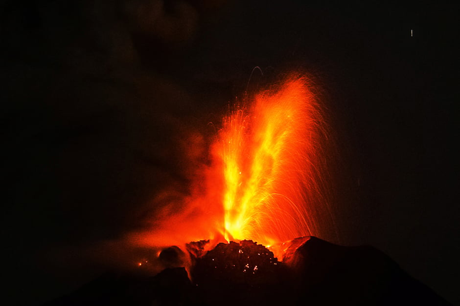 Mount Sinabung volcano spews thick volcanic ash as seen from Beganding village in Karo on early May 2, 2017. Sinabung roared back to life in 2010 for the first time in 400 years. After another period of inactivity it erupted once more in 2013, and has remained highly active since. PHOTO: AFP