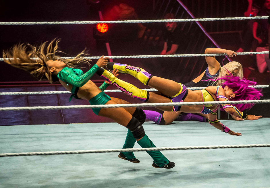 Alexa Bliss (TOP) and Bayley battle in the ring during the WWE show at Zenith Arena in Lille, France. PHOTO: AFP