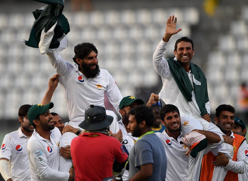 Misbah-ul-Haq (L) and Younis Khan (R) are carried by teammates as they celebrate after winning the final test match and the series 2-1 against the West Indies at the Windsor Park Stadium in Roseau, Dominica. PHOTO: AFP