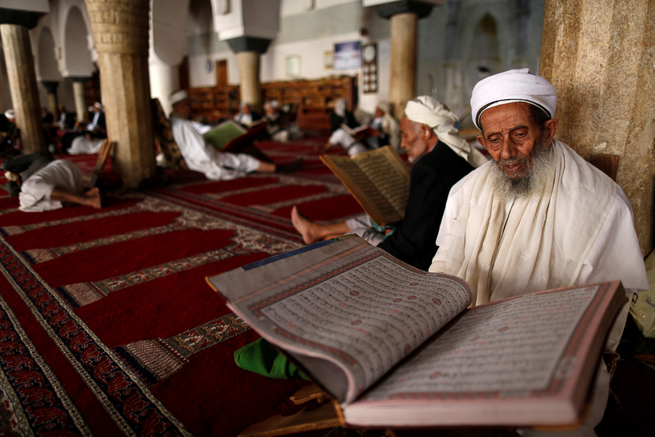 A man reads the Quran at the Grand Mosque during the holy month of Ramadan in Sanaa, Yemen. PHOTO: REUTERS