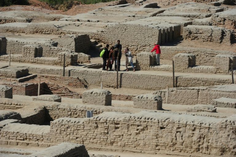 n this photograph taken on February 9, 2017, visitors walk through the UNESCO World Heritage archeological site of Mohenjo Daro some 425 kms north of the Pakistani city of Karachi. PHOTO: AFP