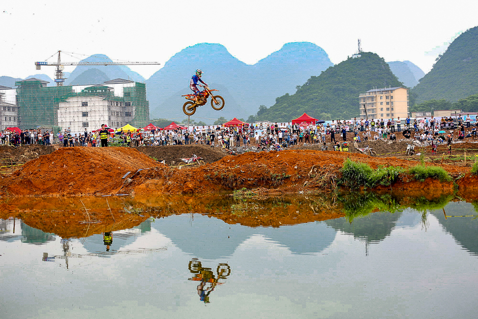 A rider rides a motorcycle in the air during a competition at Guilin, Guangxi Zhuang Autonomous Region, China. PHOTO: REUTERS
