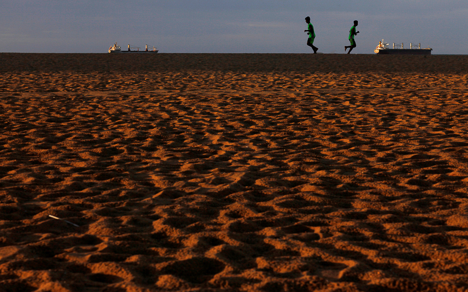 People jog at Iracema beach in Fortaleza, Brazil. PHOTO: REUTERS