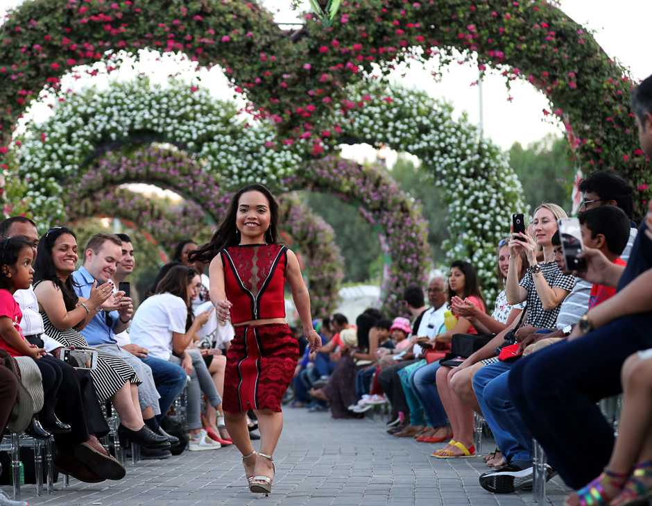 A model walks down the catwalk during the International Dwarf Fashion Show as part of the Arab Fashion Week in the United Arab Emirate of Dubai. PHOTO: AFP