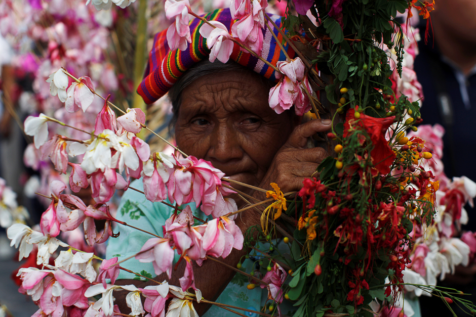 A woman takes part in a procession during the celebration of the Palms and Flowers Festival in Panchimalco, El Salvador. PHOTO: REUTERS