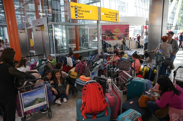 Travellers wait stranded at Heathrow Airport Terminal 5 after British Airways flights where cancelled at Heathrow Airport in west London on May 27, 2017.  PHOTO: AFP
