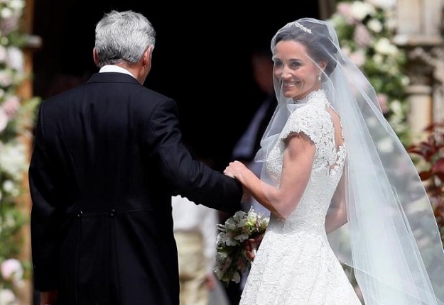 Pippa Middleton, the sister of Britain's Catherine, Duchess of Cambridge, arrives with her father Michael Middleton for her wedding to James Matthews at St Mark's Church in Englefield, west of London, on May 20, 2017.    PHOTO: REUTERS