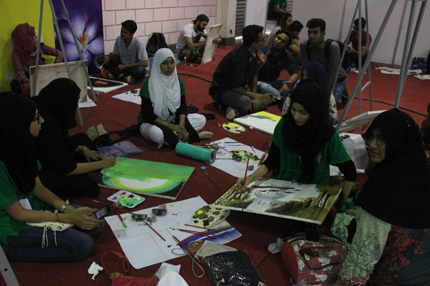 Students participate in painting competition at the expo. PHOTO: AYESHA MIR