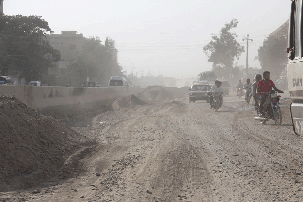 #FixIt campaigners are now demanding the immediate construction of the dilapidated portion of this road, from Malir Kala Board till Quaidabad, which is a patch of 4.5 kilometres. PHOTO: AYESHA MIR