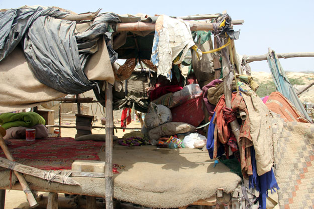 Residents live in makeshift homes made of bamboo sticks and old cloth. PHOTO: AYESHA MIR/EXPRESS