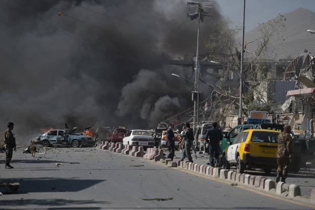Afghan security personnel are seen at the site of a car bomb attack in Kabul on May 31, 2017. PHOTO: AFP