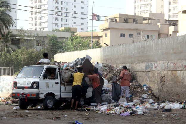 A CBC vehicle arrives at the site daily to dump trash. PHOTO: AYESHA MIR/EXPRESS