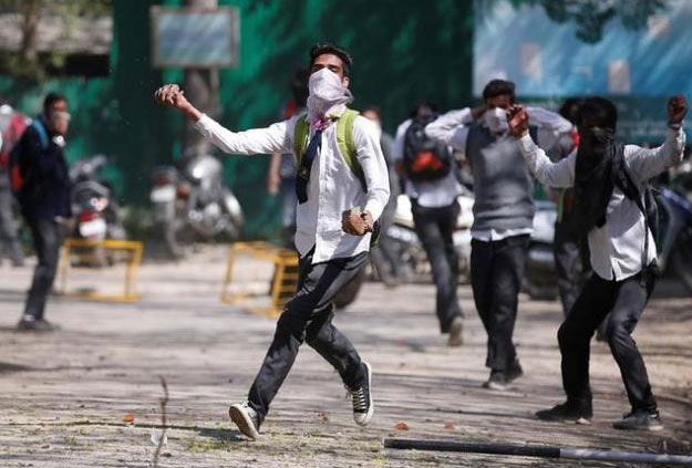 Clashes erupt in Srinagar, Kashmir as hundreds of college students took to the streets to protest a police raid on their school in southern Pulwama town. PHOTO: REUTERS