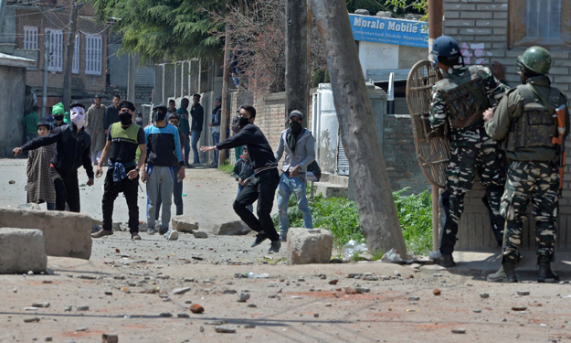 Kashmiri protesters clash with Indian security forces near a polling station on 9th April, 2017. PHOTO: AFP