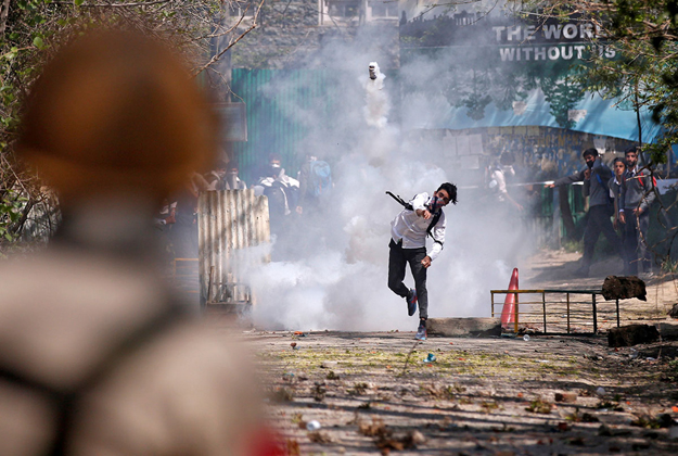 Clashes erupt in Srinagar, Kashmir as hundreds of college students took to the streets to protest a police raid on their school in southern Pulwama town. PHOTO: REUTERS 