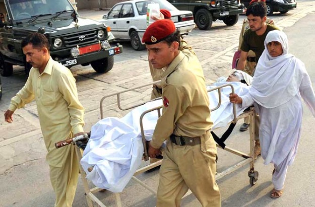 Pakistani army doctors give treatment to injured Malala Yousafzai. PHOTO: AFP